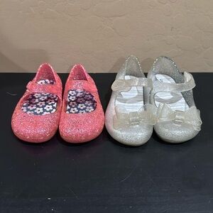 Girls/baby jelly sandals. Both size 5. The clear ones light up.